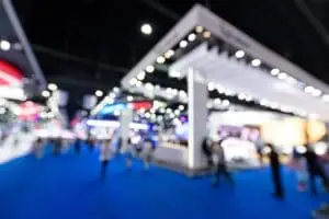 a blurry image of people walking in a blue carpet