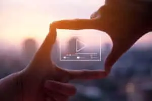 a hand framing a video